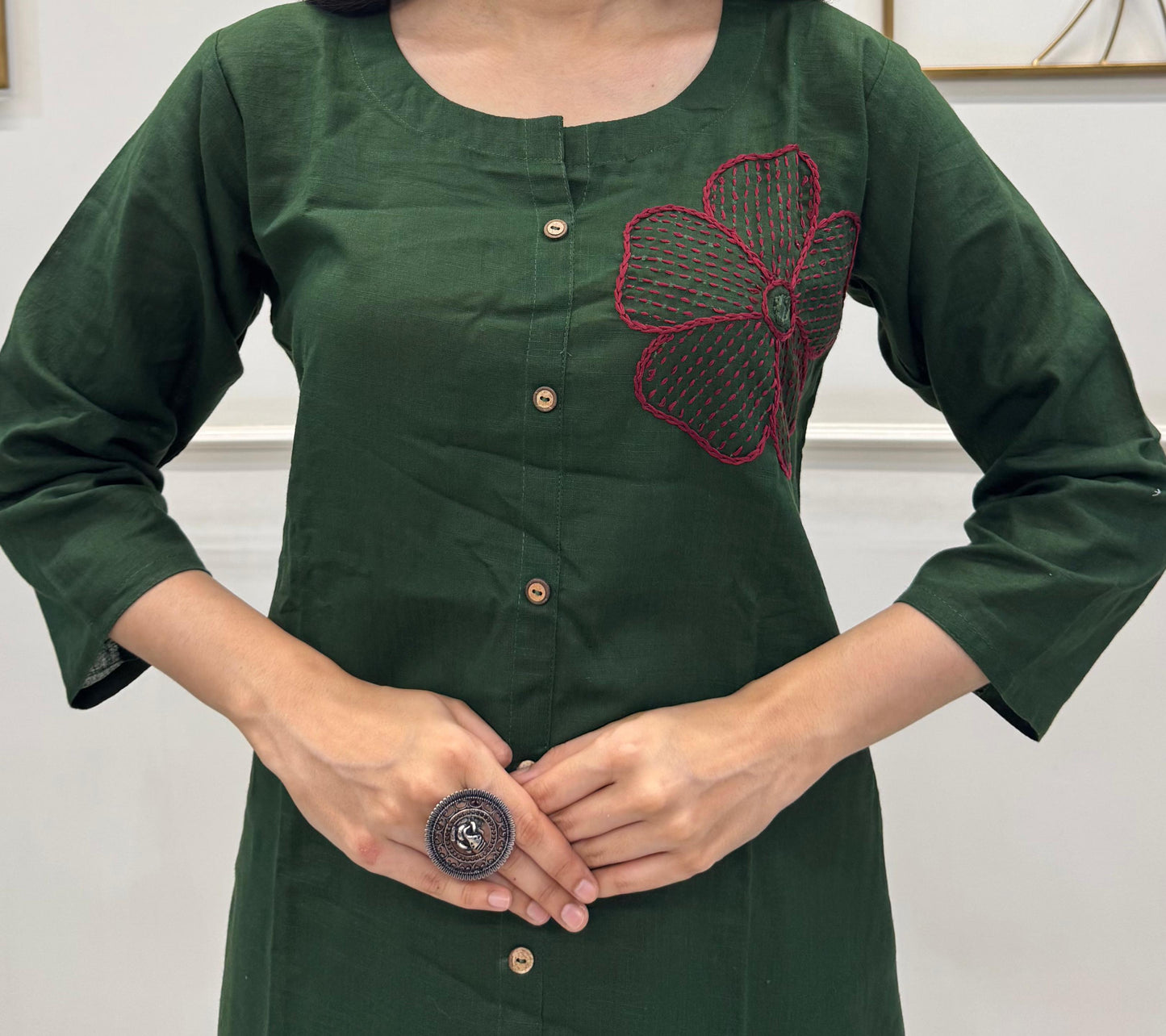 Deep Green Cotton Kurta Set With Hand Embroidery Floral Motifs.