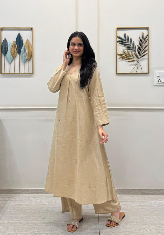 Khakhi A-Line Kurta Pant Set In Breathable Cotton And Adorned With Mirror Handwork And Danity Tassels.