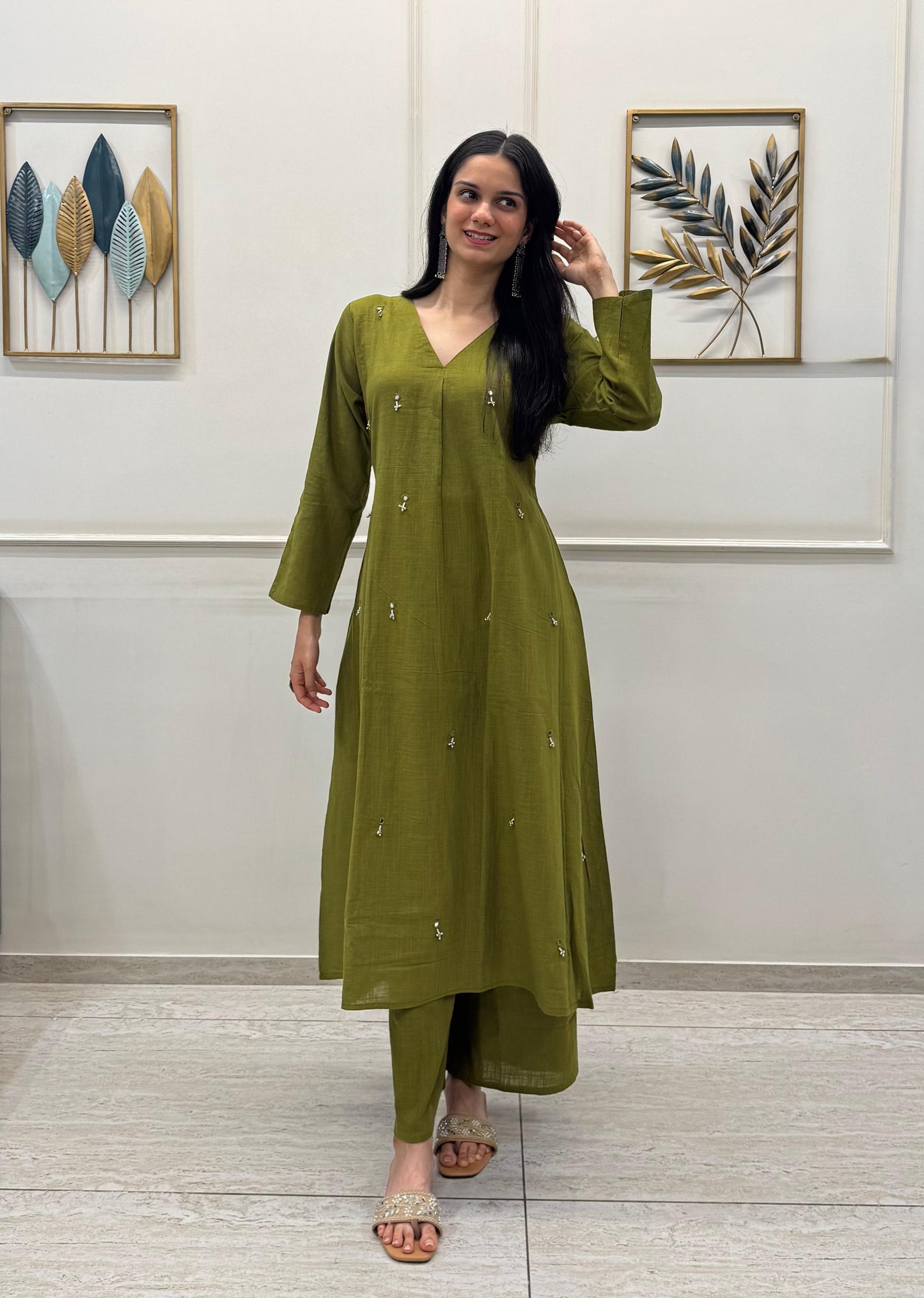 Olive Green A-Line Kurta Crafted In Breathable Cotton And Adorned With Mirror Handwork And Dainty Pearl Tassels.