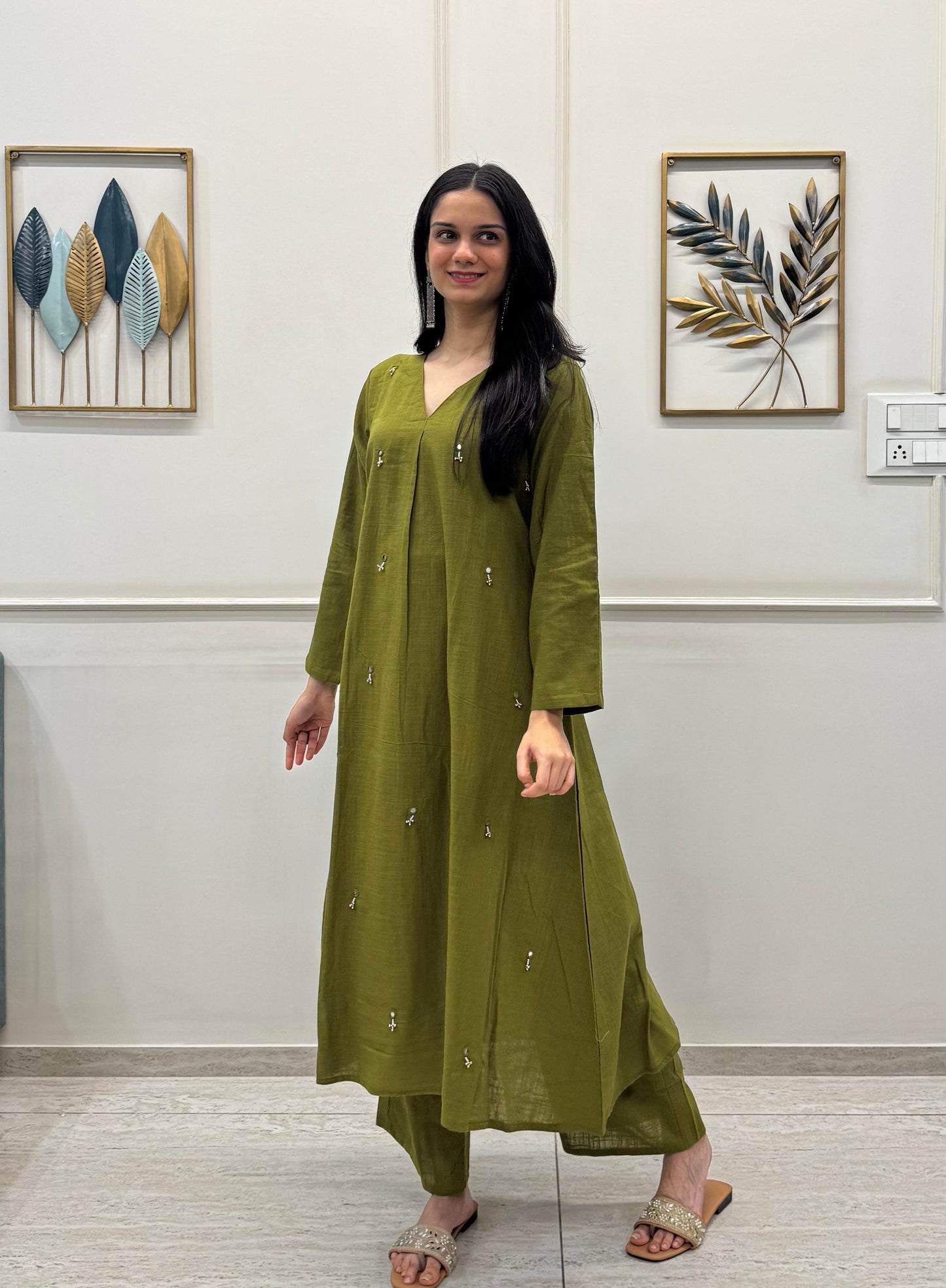 Olive Green A-Line Kurta Crafted In Breathable Cotton And Adorned With Mirror Handwork And Dainty Pearl Tassels.