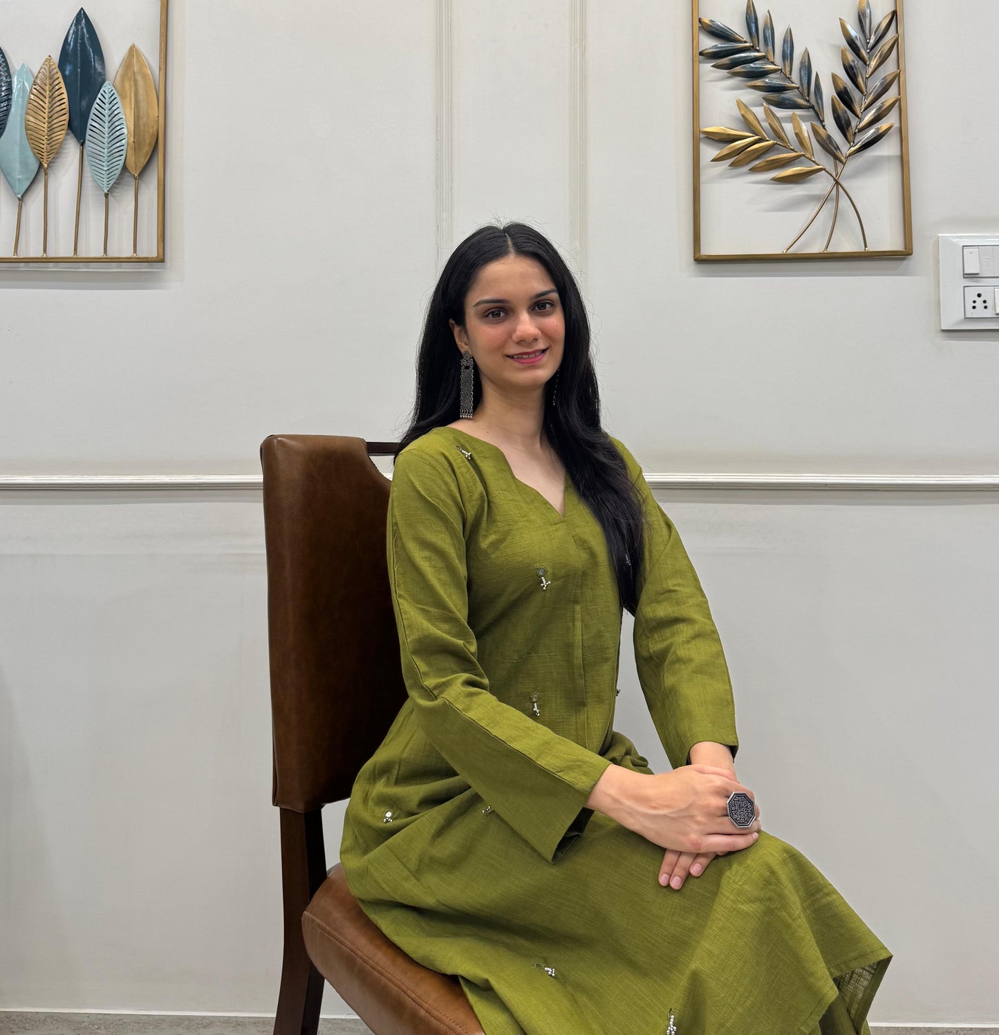 Olive Green A-Line Kurta Crafted In Breathable Cotton And Adorned With Mirror Handwork And Dainty Pearl Tassels.