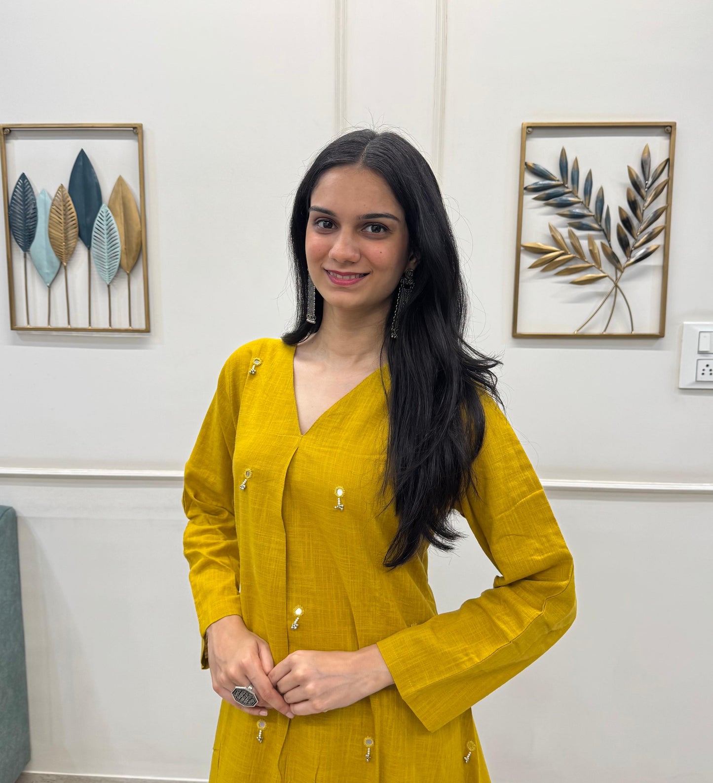 Yellow A-Line Kurta Pant Set In Breathable Cotton And Adorned With Mirror Handwork And Dainty Pearl Tassels.