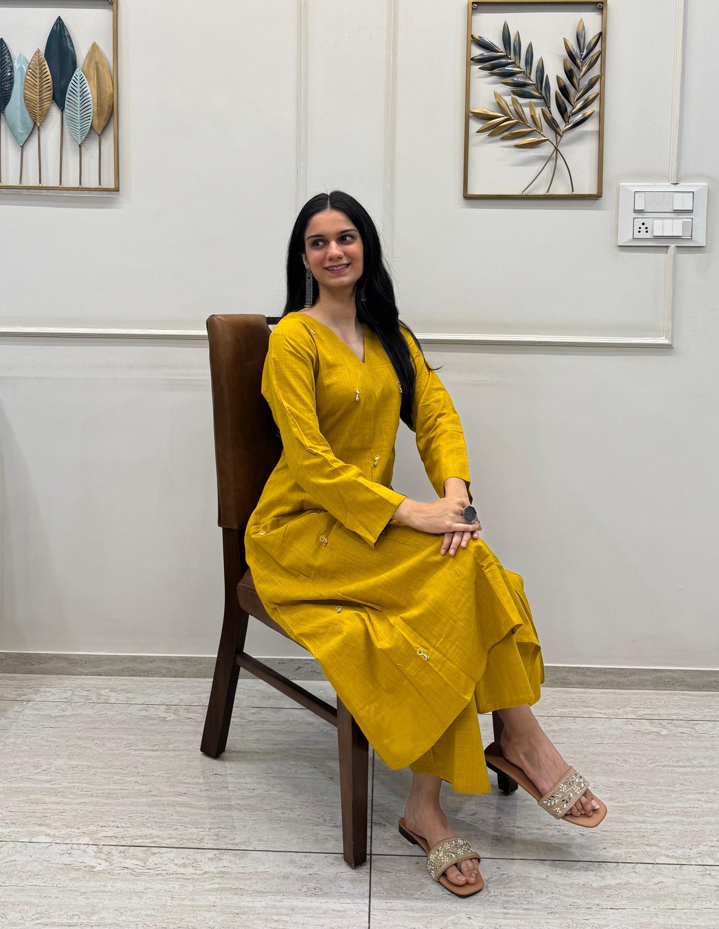 Yellow A-Line Kurta Pant Set In Breathable Cotton And Adorned With Mirror Handwork And Dainty Pearl Tassels.