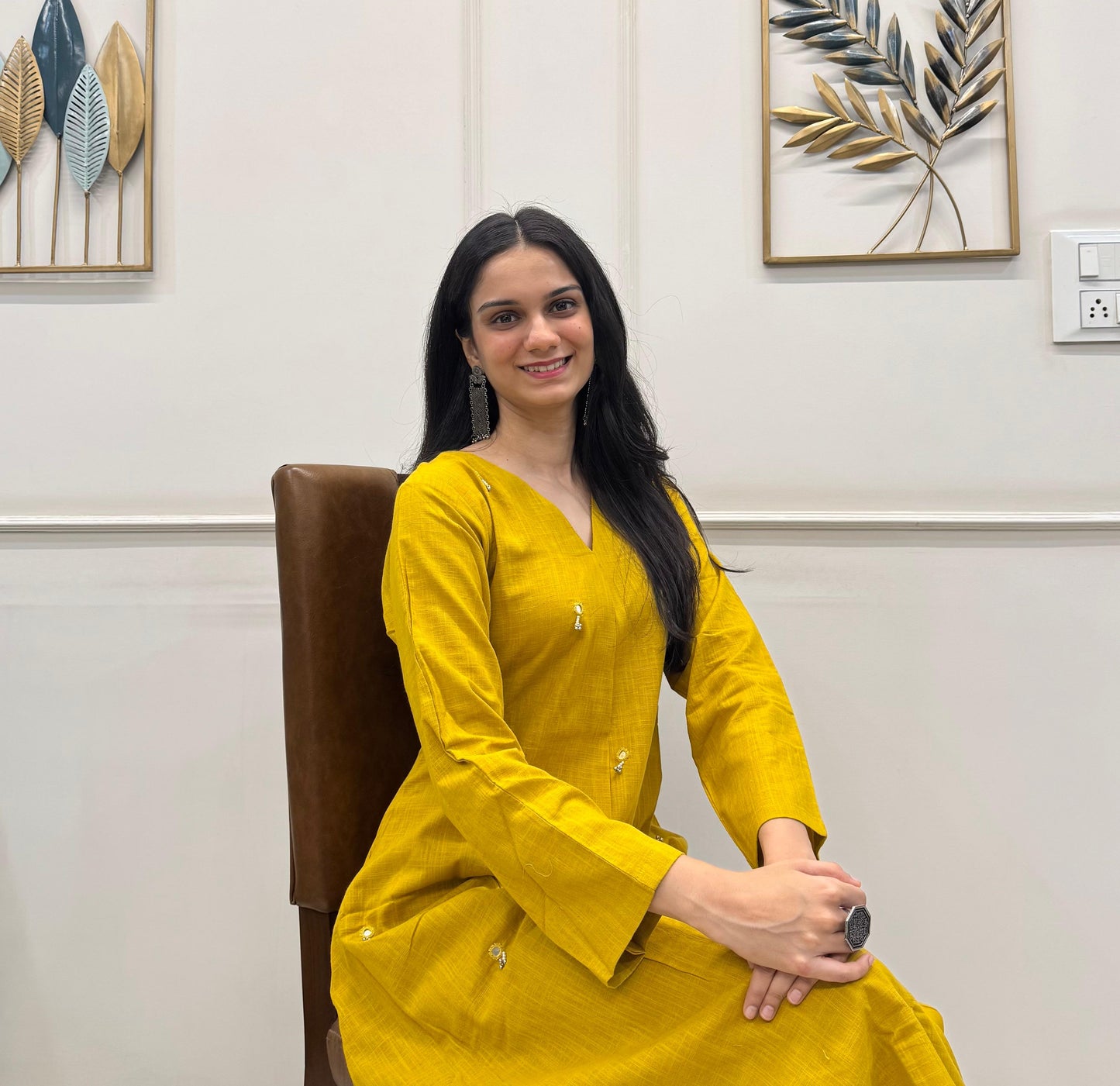 Yellow A-Line Kurta Pant Set In Breathable Cotton And Adorned With Mirror Handwork And Dainty Pearl Tassels.