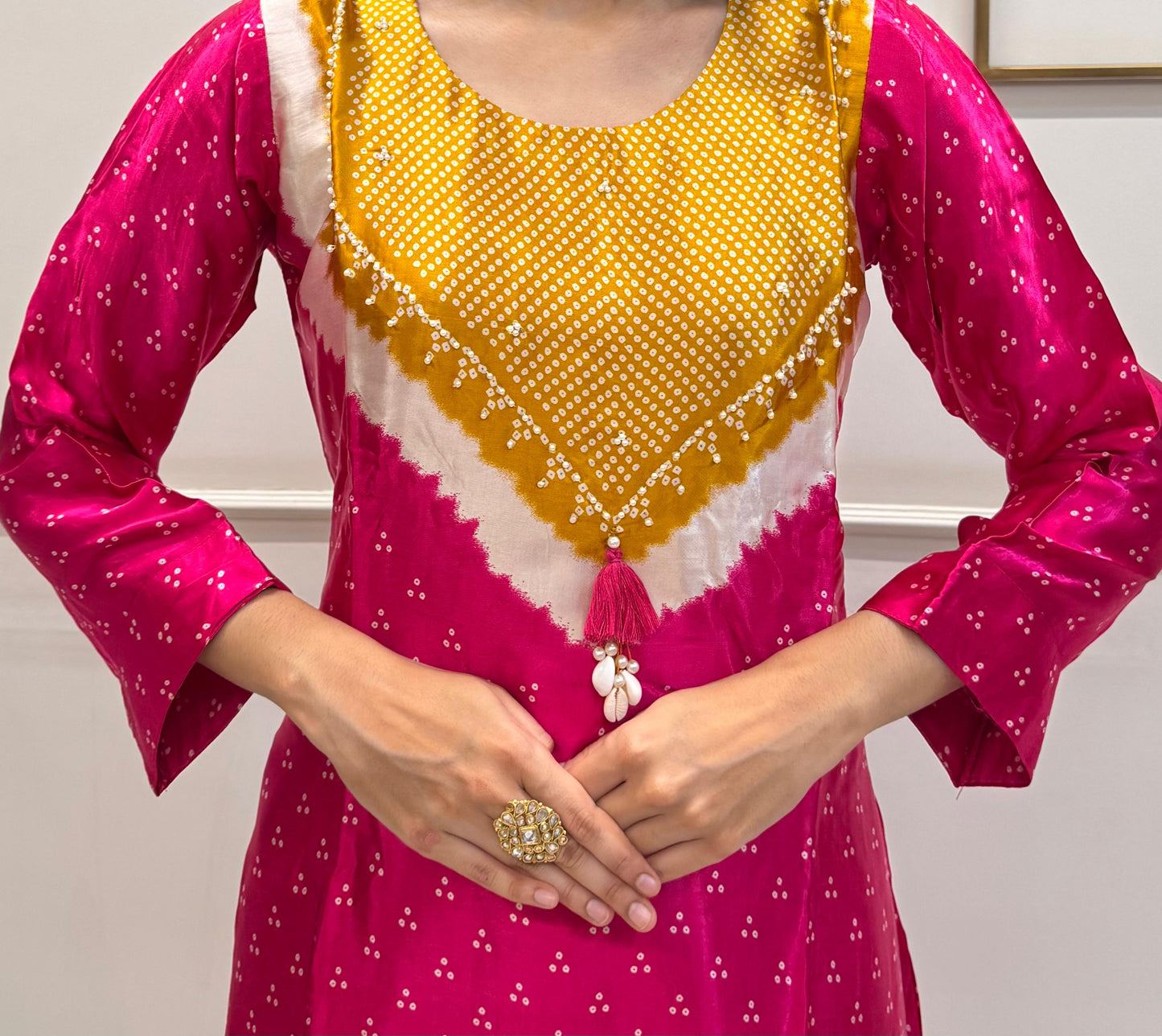 Soft Gaji Silk In Bandhani Prints With Minimal Detailing.