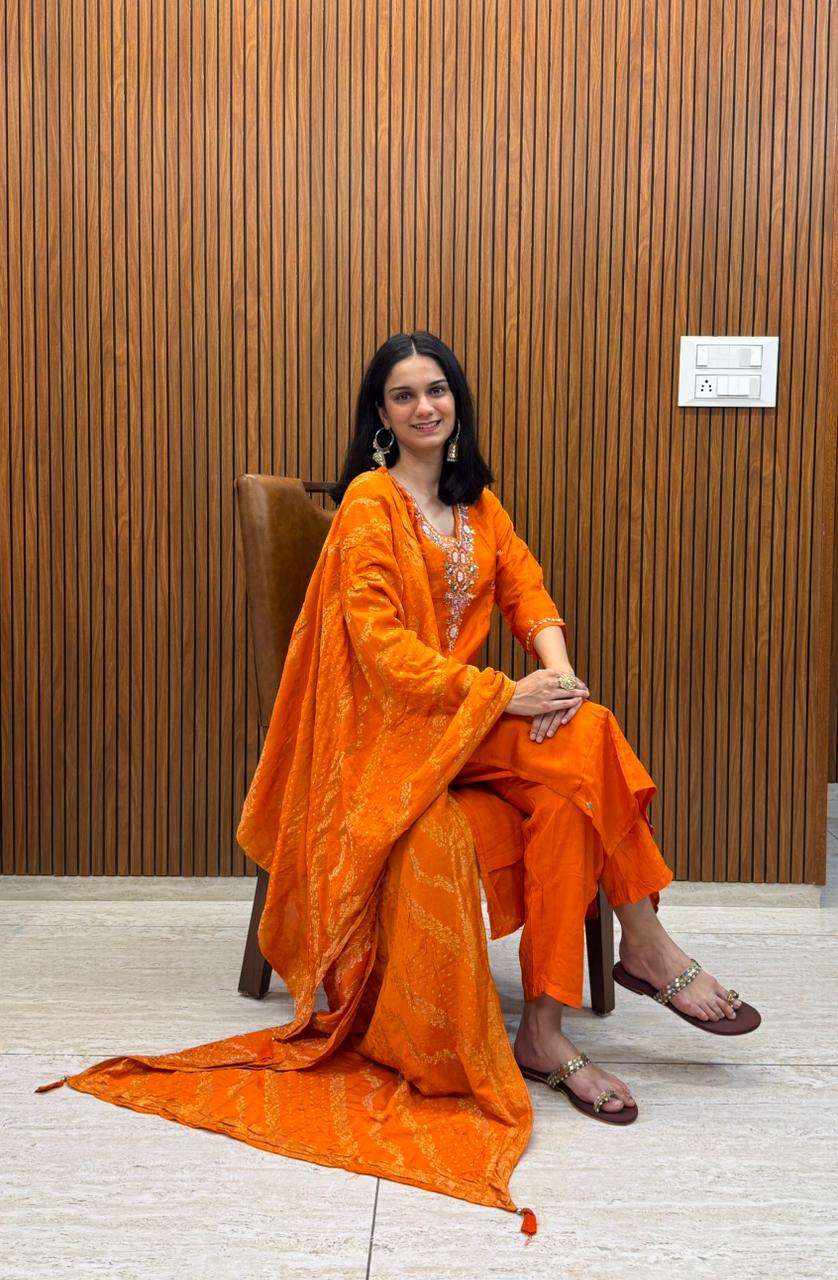 Orange Dola Silk Outfit With Fine Hand Work.