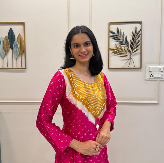 Soft Gaji Silk In Bandhani Prints With Minimal Detailing.